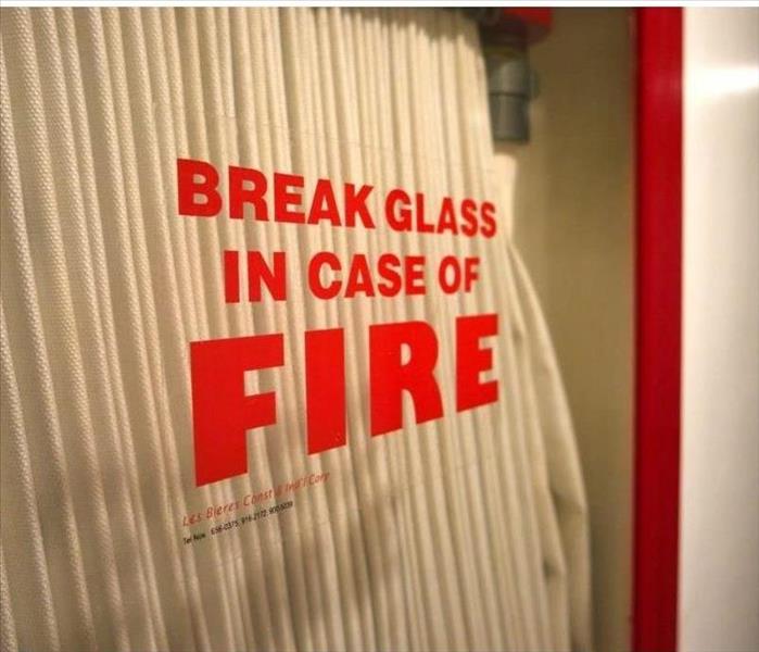 Fire hose in glass case