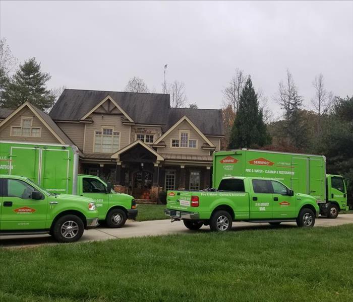 SERVPRO truck, van, box truck, house, yard